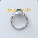 Load image into Gallery viewer, Verdant Elegance: Lustrous Round Green Emerald Surrounded by Dazzling Halo