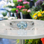 Load image into Gallery viewer, Crystal Clear Love: Lustrous Silver Ring with 1ct Oval Aquamarine and Dazzling Moissanites Split Shank Details