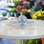 Load image into Gallery viewer, Bridal Elegance in Sea Tones: Oval Aquamarine Halo Engagement Ring's Ethereal Beauty