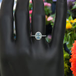 Load image into Gallery viewer, Bridal Elegance in Sea Tones: Oval Aquamarine Halo Engagement Ring's Ethereal Beauty