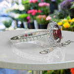 Load image into Gallery viewer, Glow of Desire: Lustrous Oval Ruby & Moissanite Halo Masterpiece