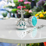 Load image into Gallery viewer, Azure Allure: Round Turquoise Stud Earrings with Vintage-Inspired Milgrain Halo.