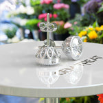 Load image into Gallery viewer, Glistening Gala: Round White Moissanite Stud Earrings with Milgrain Halo.