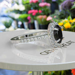 Load image into Gallery viewer, Dark Allure: Lustrous Silver Ring with Oval Black Onyx Centerpiece, Accented by Radiant Moissanites