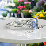 Load image into Gallery viewer, Ocean's Enchantment: 1.5ct Round Blue Moissanite Celtic Engagement Ring in Silver