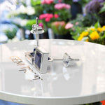 Load image into Gallery viewer, Earrings of Royalty: Bezel-Encased Princess Cut Blue Sapphire Studs.