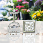 Load image into Gallery viewer, Pristine Purity: Bezel Encased Princess Cut White Moissanite Stud Earrings.
