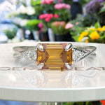 Load image into Gallery viewer, Sunny Elegance & Graceful Swirls: Emerald Cut Citrine Ring with Signature Twisted Shank