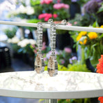 Load image into Gallery viewer, Sparkling Sips: Pear Shaped Champagne Moissanite Drop Earrings.