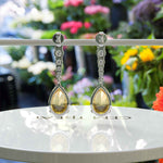 Load image into Gallery viewer, Golden Drops: Pear Cut Yellow Sapphire Drop Earrings with Moissanite Sparkle.