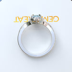 Load image into Gallery viewer, "Twisting Tides: Oval Aquamarine Ring with Moissanite Halo & Spiraled Shank