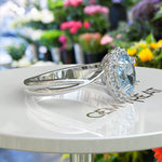 Load image into Gallery viewer, "Twisting Tides: Oval Aquamarine Ring with Moissanite Halo & Spiraled Shank