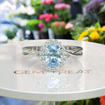Load image into Gallery viewer, "Twisting Tides: Oval Aquamarine Ring with Moissanite Halo & Spiraled Shank
