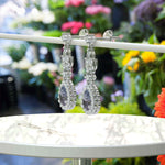 Load image into Gallery viewer, Spectral Elegance: Pear Cut Alexandrite Drop Earrings with Moissanite Halo.