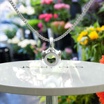 Load image into Gallery viewer, Jeweled Symphony: A Round Peridot Solitaire Pendant Necklace Awaits