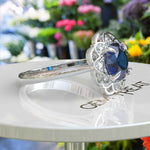 Load image into Gallery viewer, Deep Azure Dream: Round London Blue Topaz Ring with Moissanite Halo Brilliance