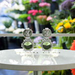 Load image into Gallery viewer, Spring Essence: Luminous Round Peridot Earrings in Elegant Drop Style.