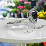 Load image into Gallery viewer, Eclipse of Art & Nature: Pear Cut Black Onyx Halo Ring with Timeless Charm