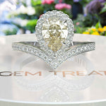 Load image into Gallery viewer, Harvest Glow: Pear-Shaped Yellow Moissanite Halo Engagement Ring in Timeless Silver Design