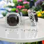 Load image into Gallery viewer, Crimson Allure: Cushion Cut Garnet Stud Earrings with Moissanite Halo.