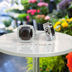 Load image into Gallery viewer, Crimson Allure: Cushion Cut Garnet Stud Earrings with Moissanite Halo.