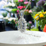 Load image into Gallery viewer, Oval Blue Moissanite Pendant Necklace Adorned with a Dazzling Halo of Moissanites