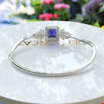 Load image into Gallery viewer, Elegance Unleashed: 4.0ct Emerald Cut Blue Sapphire Bangle Bracelet Radiance