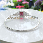 Load image into Gallery viewer, Red Radiance: Emerald Cut Ruby Bangle Bracelet with Glistening Marquise Moissanite Accents