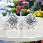 Load image into Gallery viewer, Silver Moonlight: Round Gray Moissanite Stud Earrings with Double Moissanite Halo Sparkle.