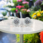 Load image into Gallery viewer, Silver Moonlight: Round Gray Moissanite Stud Earrings with Double Moissanite Halo Sparkle.