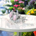 Load image into Gallery viewer, Romantic Radiance: Round Rose Quartz Stud Earrings with Double Moissanite Halo.