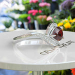 Load image into Gallery viewer, A Symphony in Red: Pear Cut Garnet Silver Halo Ring