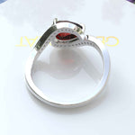 Load image into Gallery viewer, A Symphony in Red: Pear Cut Garnet Silver Halo Ring