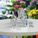 Load image into Gallery viewer, Floral Fantasy: Clustered Pear Cut Blue Moissanite Earrings.