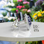 Load image into Gallery viewer, Twice the Gleam: Blue Sapphire Stud Earrings with Double Halo Design