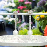 Load image into Gallery viewer, Classic Meets Sparkle: Pearl Drop Earrings with Moissanite Centerpiece.