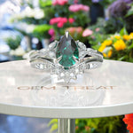 Load image into Gallery viewer, Nuptial Wonders in Verdant: Dive into the Pear Cut Green Emerald Ring Set, Adorned with Marquise Gems