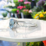 Load image into Gallery viewer, 1.5ct Oval Aquamarine Engagement Ring: Sparkling Marquise Moissanites on Silver Band Illuminate Love's Journey