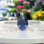 Load image into Gallery viewer, Deep Sea Elegance: Pear Cut London Blue Topaz Ring with Marquise Moissanite Accents in Silver