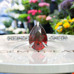 Load image into Gallery viewer, Gems of Desire and Dreams: Pear Cut Ruby Ring Elegance, Elevated by Marquise Moissanite Details