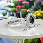 Load image into Gallery viewer, Elegant Radiance: Round Black Onyx Ring with Sparkling Halo Detail
