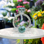 Load image into Gallery viewer, Ocean's Serenade Captured: Cyan Blue Portuguese Cut Adorns Under Halo Ring Setting