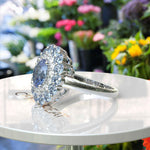 Load image into Gallery viewer, Stunning Oval Blue Moissanite Surrounded by Glistening Double Halo Ring