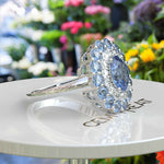 Load image into Gallery viewer, Stunning Oval Blue Moissanite Surrounded by Glistening Double Halo Ring