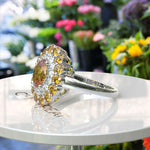 Load image into Gallery viewer, Dual Luster: Elegant Oval Citrine Ring Flanked by Moissanite & Citrine Halo