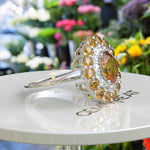 Load image into Gallery viewer, Dual Luster: Elegant Oval Citrine Ring Flanked by Moissanite & Citrine Halo