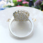 Load image into Gallery viewer, Dual Luster: Elegant Oval Citrine Ring Flanked by Moissanite & Citrine Halo