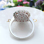 Load image into Gallery viewer, Whispers of Romance: Discover the Lustrous Oval Halo Garnet within This Ring Design