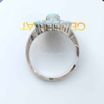 Load image into Gallery viewer, Ethereal Glow: Oval Opal Centerpiece Ring Surrounded by Moissanite and Opal Halo