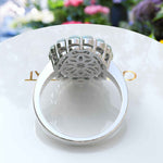 Load image into Gallery viewer, Ethereal Glow: Oval Opal Centerpiece Ring Surrounded by Moissanite and Opal Halo